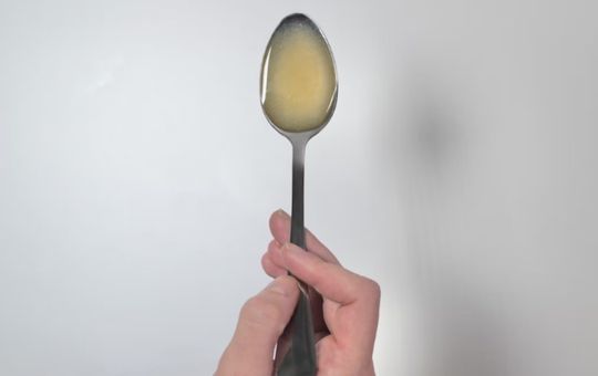 liposomal pre+ probiotic poured into a spoon