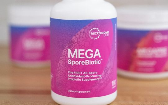 Megasporebiotics in the background with a bottle of megaspore in the forefront