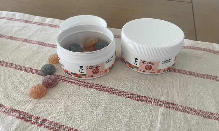 two containers of five cbd thc gummies